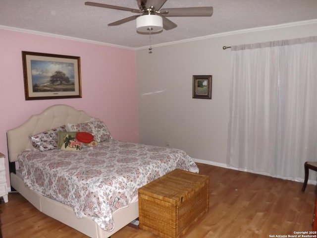 2300 Nacogdoches Unit 210C, San Antonio, TX 78209 - bedroom with wood finished floors, ornamental molding, a ceiling fan, and baseboards