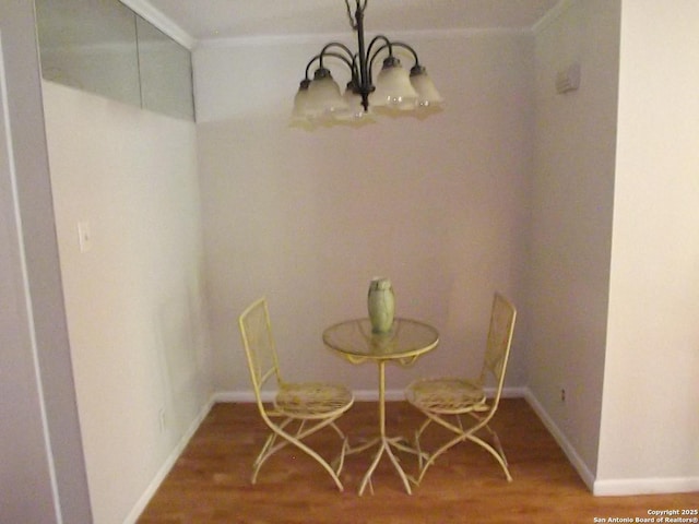 2300 Nacogdoches Unit 210C, San Antonio, TX 78209 - dining space featuring a chandelier, wood finished floors, ornamental molding, and baseboards