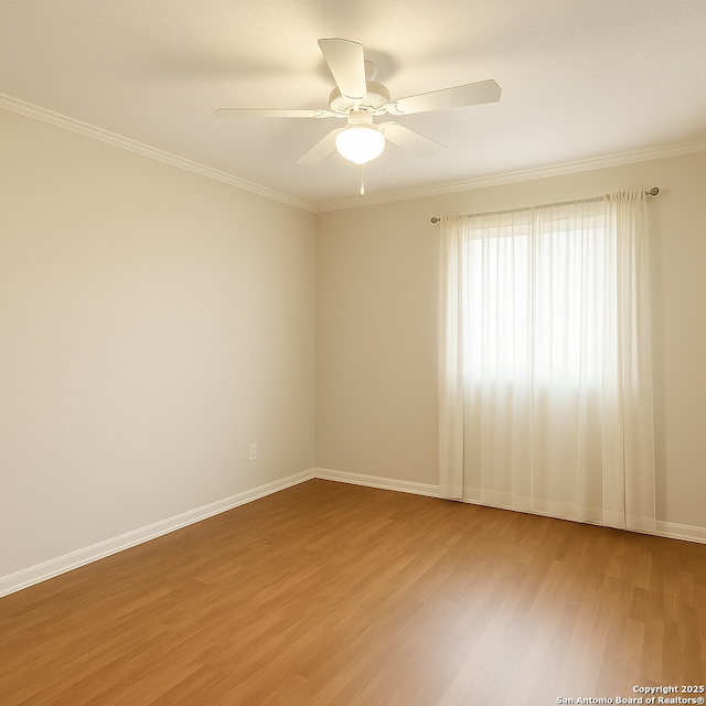 2300 Nacogdoches Unit 210C, San Antonio, TX 78209 - empty room featuring light wood finished floors, crown molding, ceiling fan, and baseboards