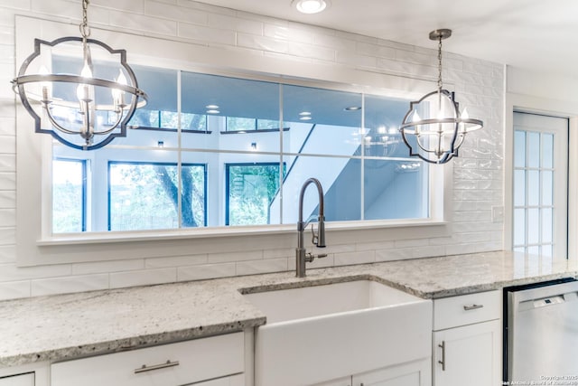 15021 Seven L Trl, Helotes, TX 78023 - kitchen featuring a chandelier, dishwasher, a sink, and decorative backsplash