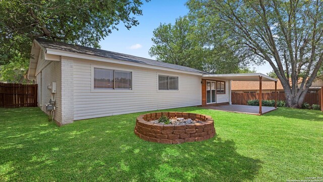 5815 Freemans Farm St, San Antonio, TX 78233 - back of house with a patio area, brick siding, and an outdoor fire pit