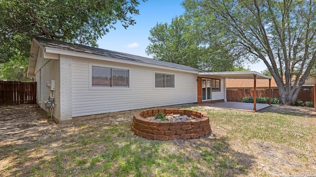 5815 Freemans Farm St, San Antonio, TX 78233 - back of property with a patio area, an outdoor fire pit, and brick siding