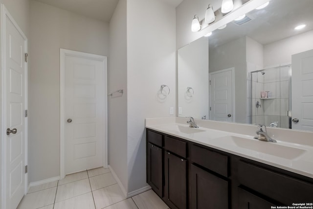 7731 Chatham, San Antonio, TX 78218 - bathroom with a shower stall, tile patterned flooring, double vanity, and baseboards
