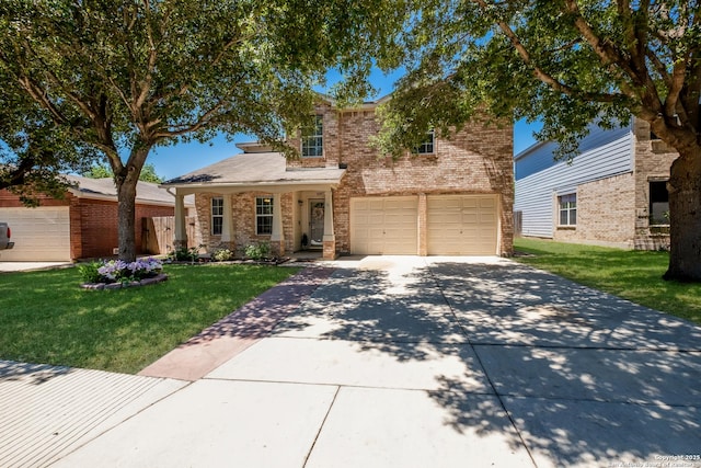 traditional-style house featuring brick siding, a front yard, driveway, and a garage