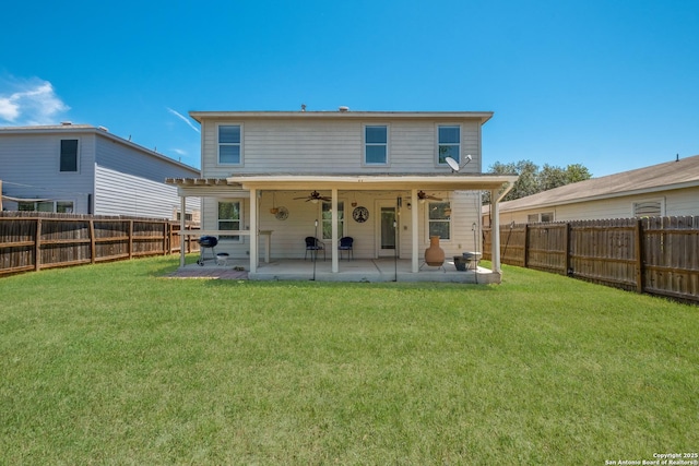 back of house with ceiling fan and a patio area