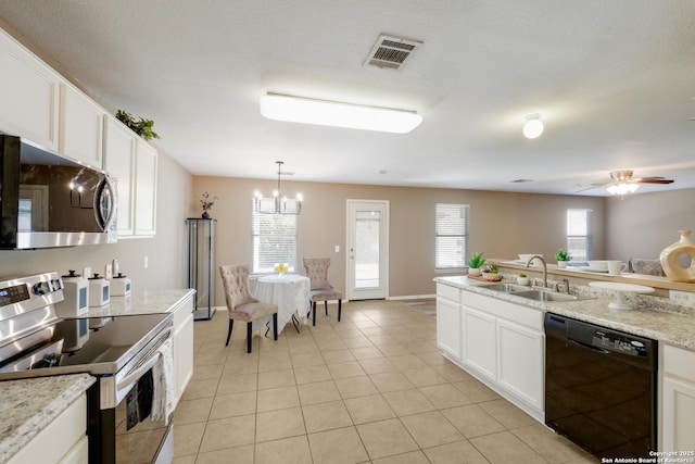 kitchen with stainless steel appliances, a sink, light tile patterned floors, and white cabinetry