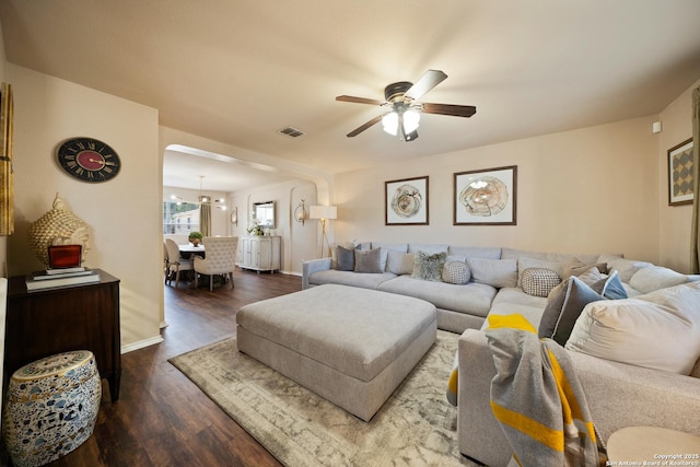 15206 Redbird Mnr, San Antonio, TX 78253 - living room featuring baseboards, a ceiling fan, and dark wood-type flooring