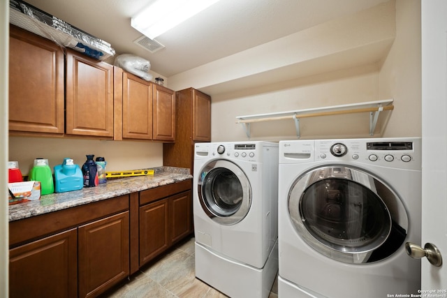 15206 Redbird Mnr, San Antonio, TX 78253 - washroom featuring separate washer and dryer and cabinet space