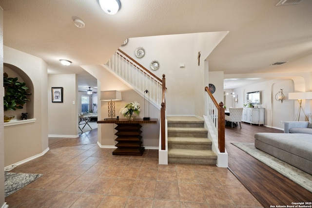 15206 Redbird Mnr, San Antonio, TX 78253 - stairs with plenty of natural light, baseboards, ceiling fan, and tile patterned flooring