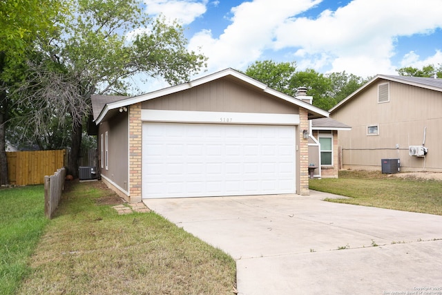 5107 Anacacho, San Antonio, TX 78217 - view of front of house featuring concrete driveway, an attached garage, central air condition unit, and a chimney