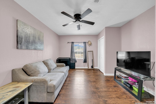 8239 Glen Lark, San Antonio, TX 78239 - living area with dark wood-type flooring, ceiling fan, and baseboards