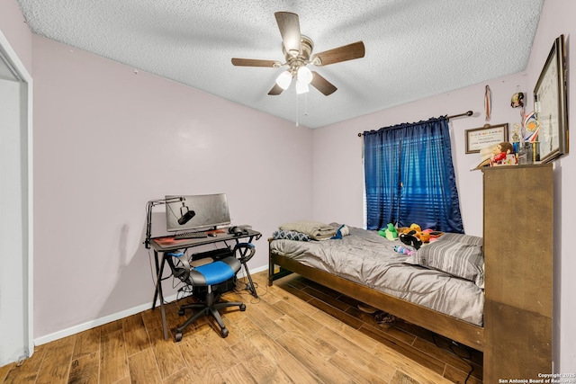 8239 Glen Lark, San Antonio, TX 78239 - bedroom with a textured ceiling, wood finished floors, baseboards, and ceiling fan