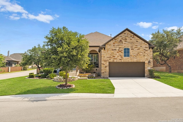 28914 Gracies Sky, San Antonio, TX 78260 - view of front facade with an attached garage, concrete driveway, a front lawn, and stone siding