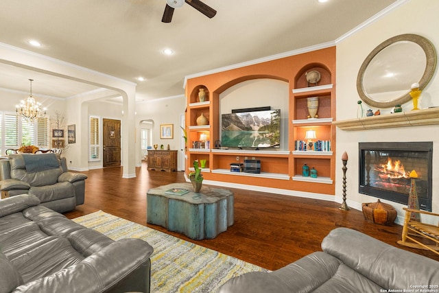 28914 Gracies Sky, San Antonio, TX 78260 - living area with built in shelves, wood finished floors, a ceiling fan, a chandelier, and baseboards