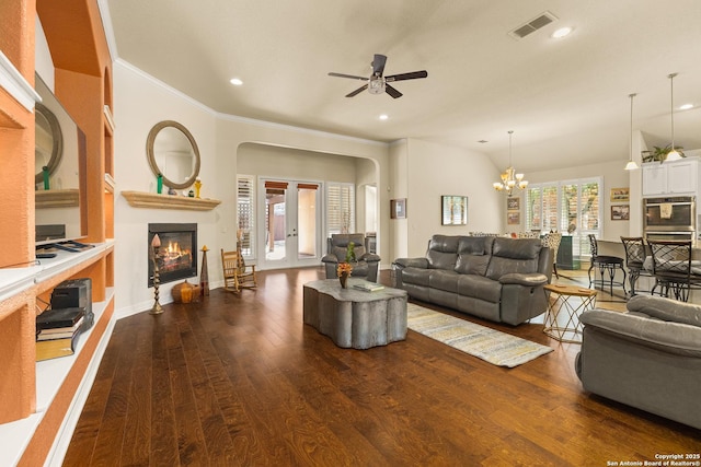 28914 Gracies Sky, San Antonio, TX 78260 - living area featuring a glass covered fireplace, dark wood-style flooring, a ceiling fan, arched walkways, and recessed lighting