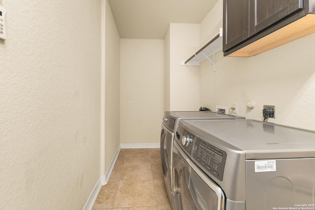28914 Gracies Sky, San Antonio, TX 78260 - laundry area featuring cabinet space, washing machine and dryer, baseboards, a textured wall, and light tile patterned flooring