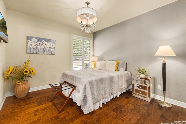 28914 Gracies Sky, San Antonio, TX 78260 - bedroom with baseboards, wood finished floors, and a chandelier