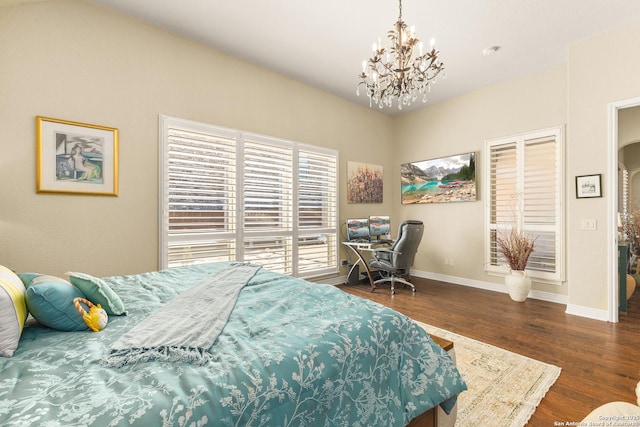 28914 Gracies Sky, San Antonio, TX 78260 - bedroom with a chandelier, baseboards, and wood finished floors