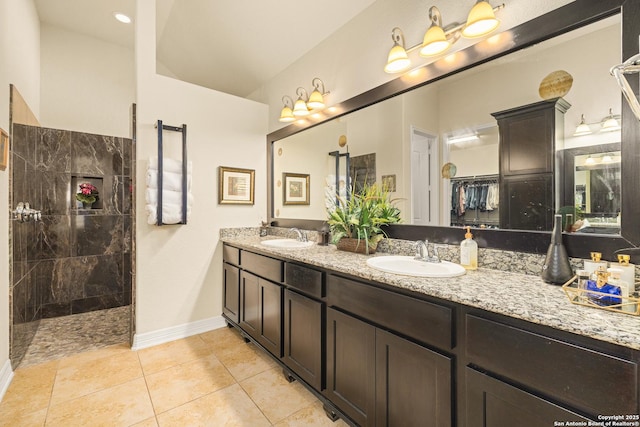 28914 Gracies Sky, San Antonio, TX 78260 - bathroom with double vanity, a walk in shower, tile patterned floors, and baseboards