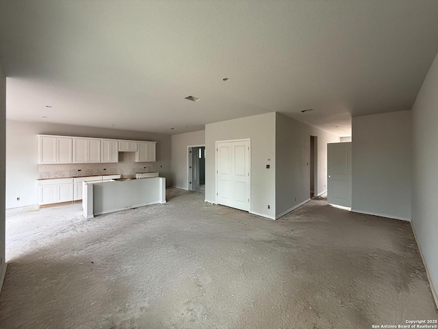 13726 Birch Xing, San Antonio, TX 78252 - unfurnished living room featuring unfinished concrete flooring