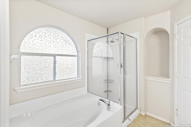 full bath featuring a shower stall and a bath