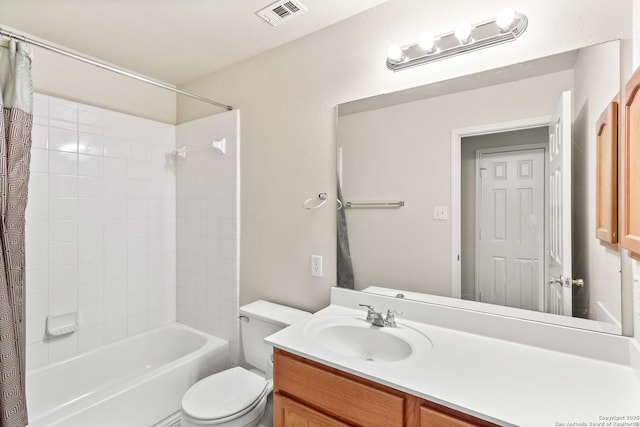 full bath featuring toilet, vanity, and shower / tub combo