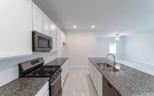 6726 Velma Path, San Antonio, TX 78253 - kitchen with appliances with stainless steel finishes, a sink, dark stone counters, backsplash, and recessed lighting