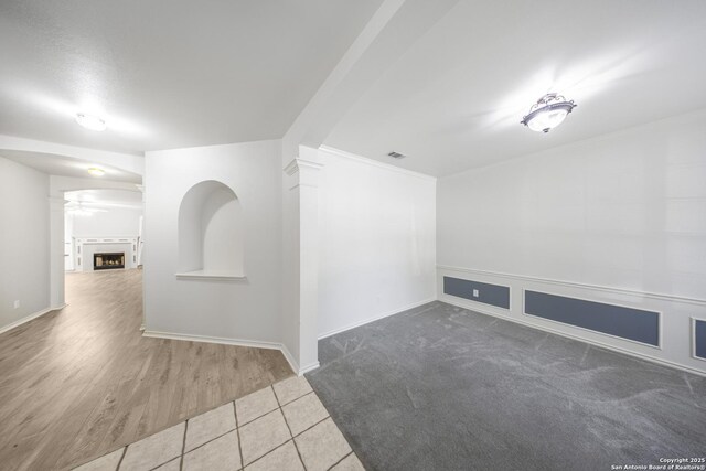 4726 Shavano Bark, San Antonio, TX 78230 - unfurnished room featuring baseboards, tile patterned floors, and arched walkways