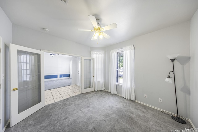 4726 Shavano Bark, San Antonio, TX 78230 - carpeted empty room with french doors, a smoke detector, ceiling fan, baseboards, and tile patterned flooring