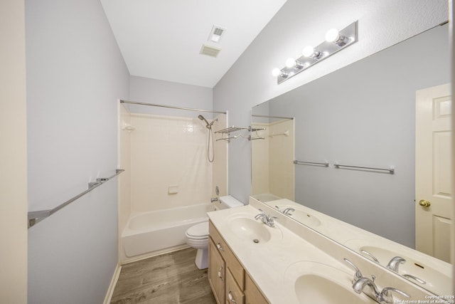 4726 Shavano Bark, San Antonio, TX 78230 - bathroom featuring wood finished floors, toilet, shower / washtub combination, double vanity, and baseboards