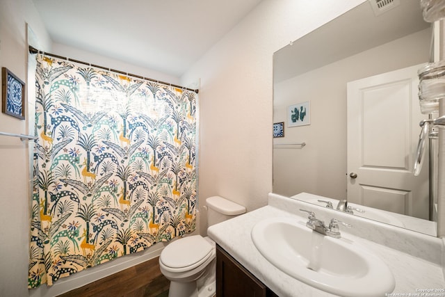 9827 Western Sedge, San Antonio, TX 78254 - bathroom with toilet, vanity, wood finished floors, and a shower with curtain