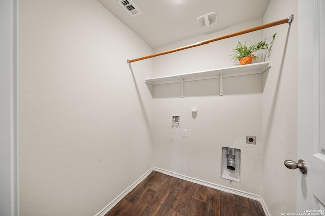 9827 Western Sedge, San Antonio, TX 78254 - laundry area with dark wood-style flooring, washer hookup, gas dryer hookup, hookup for an electric dryer, and baseboards