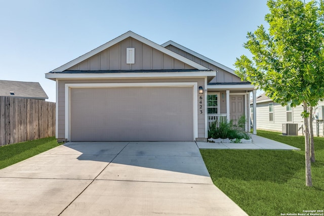 6423 Tractor, San Antonio, TX 78252 - ranch-style home featuring board and batten siding, concrete driveway, an attached garage, and central air condition unit