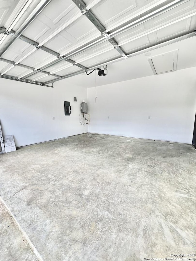 6427 Ridge Cir, San Antonio, TX 78233 - garage featuring a garage door opener and electric panel