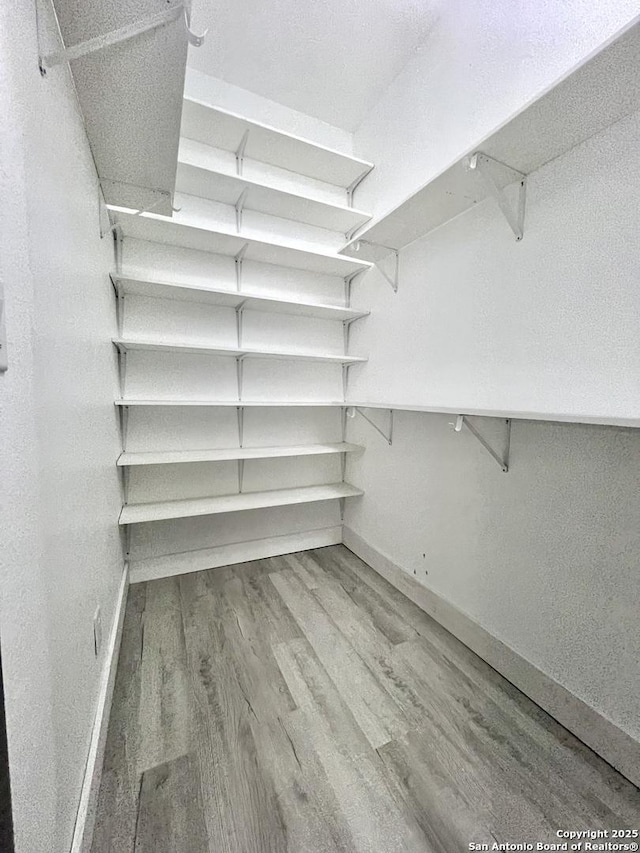 6427 Ridge Cir, San Antonio, TX 78233 - walk in closet featuring wood finished floors