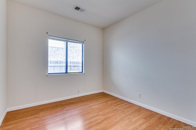 9419 Camino Venado, Helotes, TX 78023 - empty room with light wood finished floors and baseboards