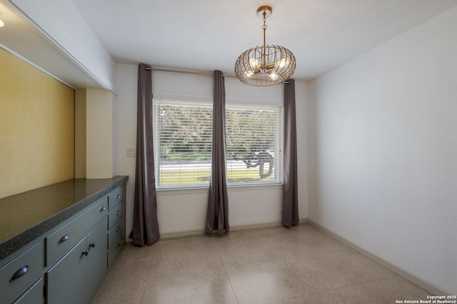 226 Carolwood Dr, Castle Hills, TX 78213 - unfurnished dining area featuring a chandelier and baseboards