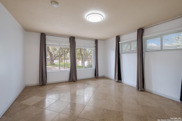 226 Carolwood Dr, Castle Hills, TX 78213 - spare room with baseboards and light tile patterned floors