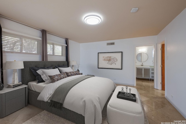 226 Carolwood Dr, Castle Hills, TX 78213 - bedroom with baseboards and ensuite bathroom