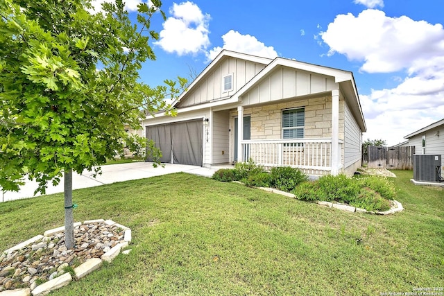 1919 Goldfinch, New Braunfels, TX 78130 - view of front facade with board and batten siding, a porch, cooling unit, concrete driveway, and an attached garage