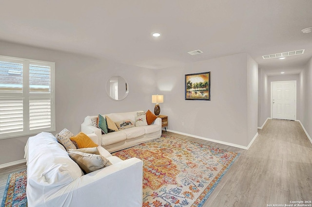 1919 Goldfinch, New Braunfels, TX 78130 - living room featuring light wood-type flooring, baseboards, and recessed lighting