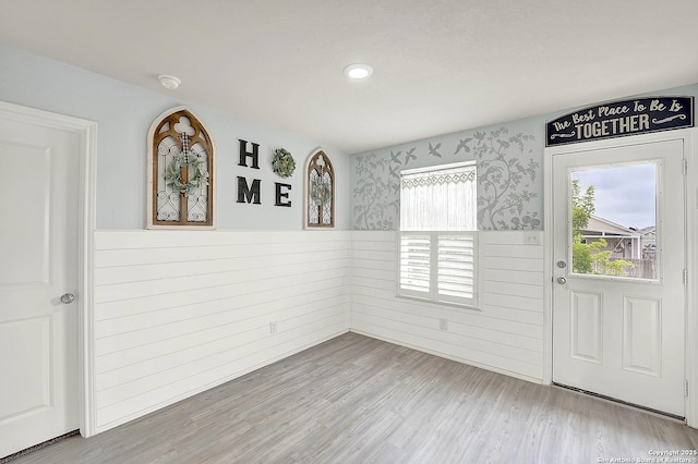 1919 Goldfinch, New Braunfels, TX 78130 - unfurnished dining area featuring a wainscoted wall, wood finished floors, recessed lighting, and wallpapered walls