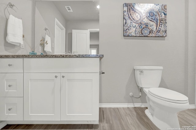 1919 Goldfinch, New Braunfels, TX 78130 - half bath featuring baseboards, wood finished floors, toilet, and vanity