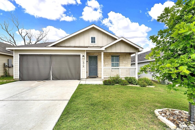 1919 Goldfinch, New Braunfels, TX 78130 - view of front of house featuring covered porch, concrete driveway, board and batten siding, a garage, and a front lawn