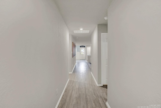 1919 Goldfinch, New Braunfels, TX 78130 - corridor with baseboards and light wood finished floors