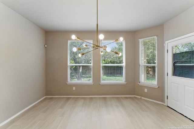 6739 Indian, San Antonio, TX 78253 - unfurnished dining area featuring light wood finished floors, a chandelier, and baseboards