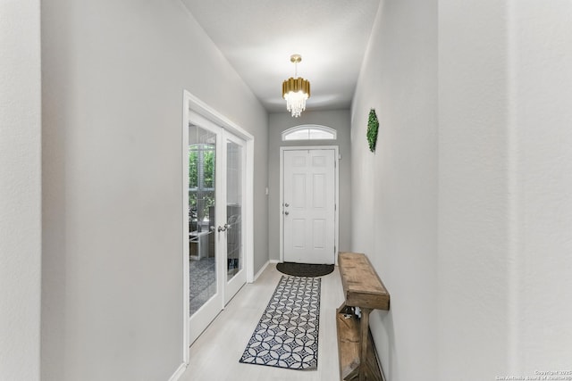 6739 Indian, San Antonio, TX 78253 - doorway featuring light wood finished floors, baseboards, and french doors