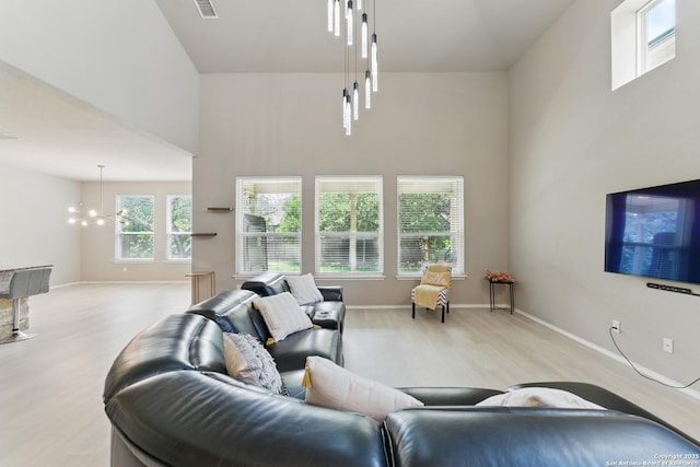 6739 Indian, San Antonio, TX 78253 - living area with light wood-type flooring, a high ceiling, and baseboards