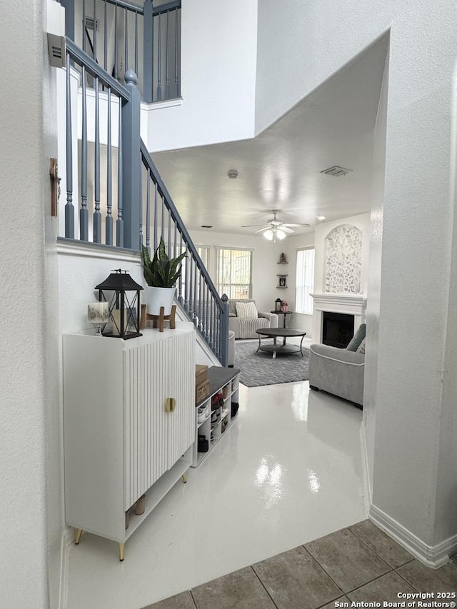 22722 Sabine, San Antonio, TX 78258 - living area with ceiling fan, stairs, tile patterned floors, and baseboards