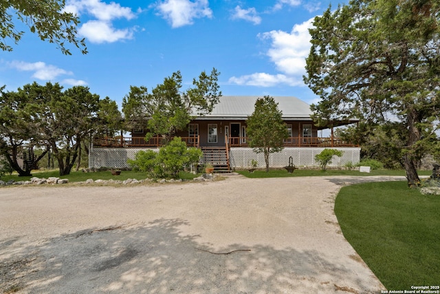 388 Oak, Pipe Creek, TX 78063 - view of front facade with covered porch, a front yard, and driveway
